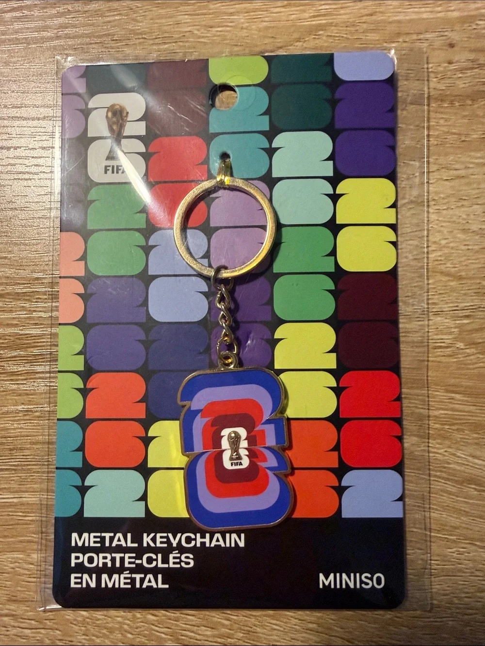 MINISO FIFA Multicolor Metal Keychain — Blue, Red & Purple Accent